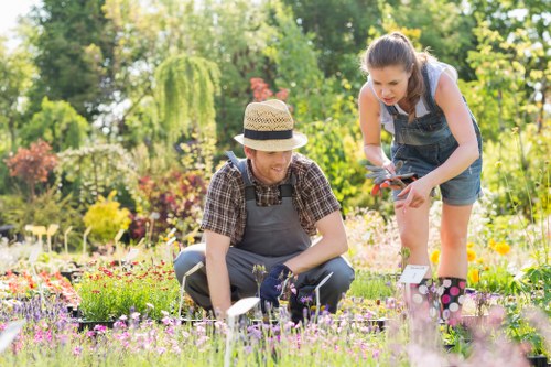 Community gardener sorting garden waste in Neasden